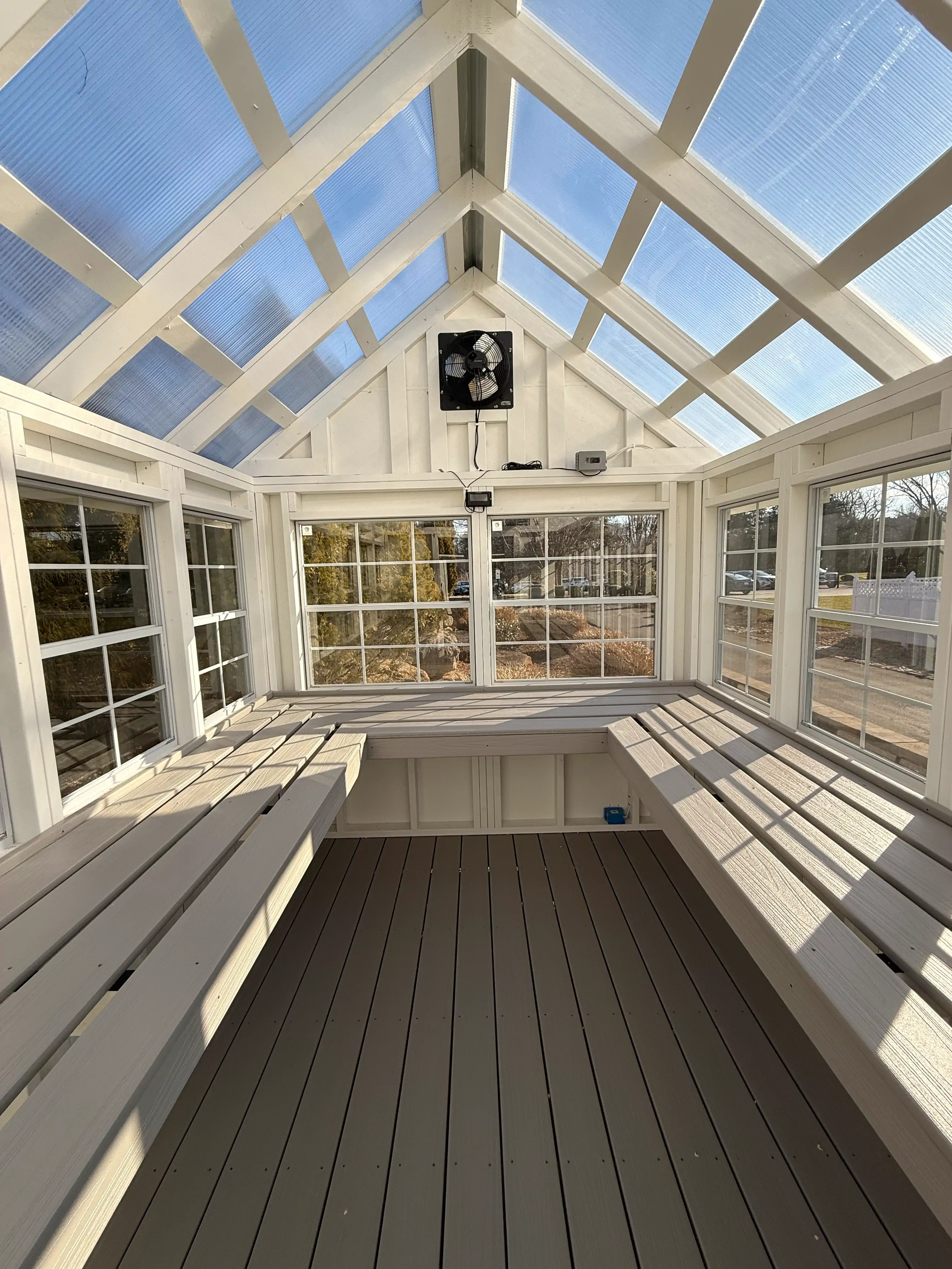 Handcrafted Wood and Metal Greenhouses Side by Side