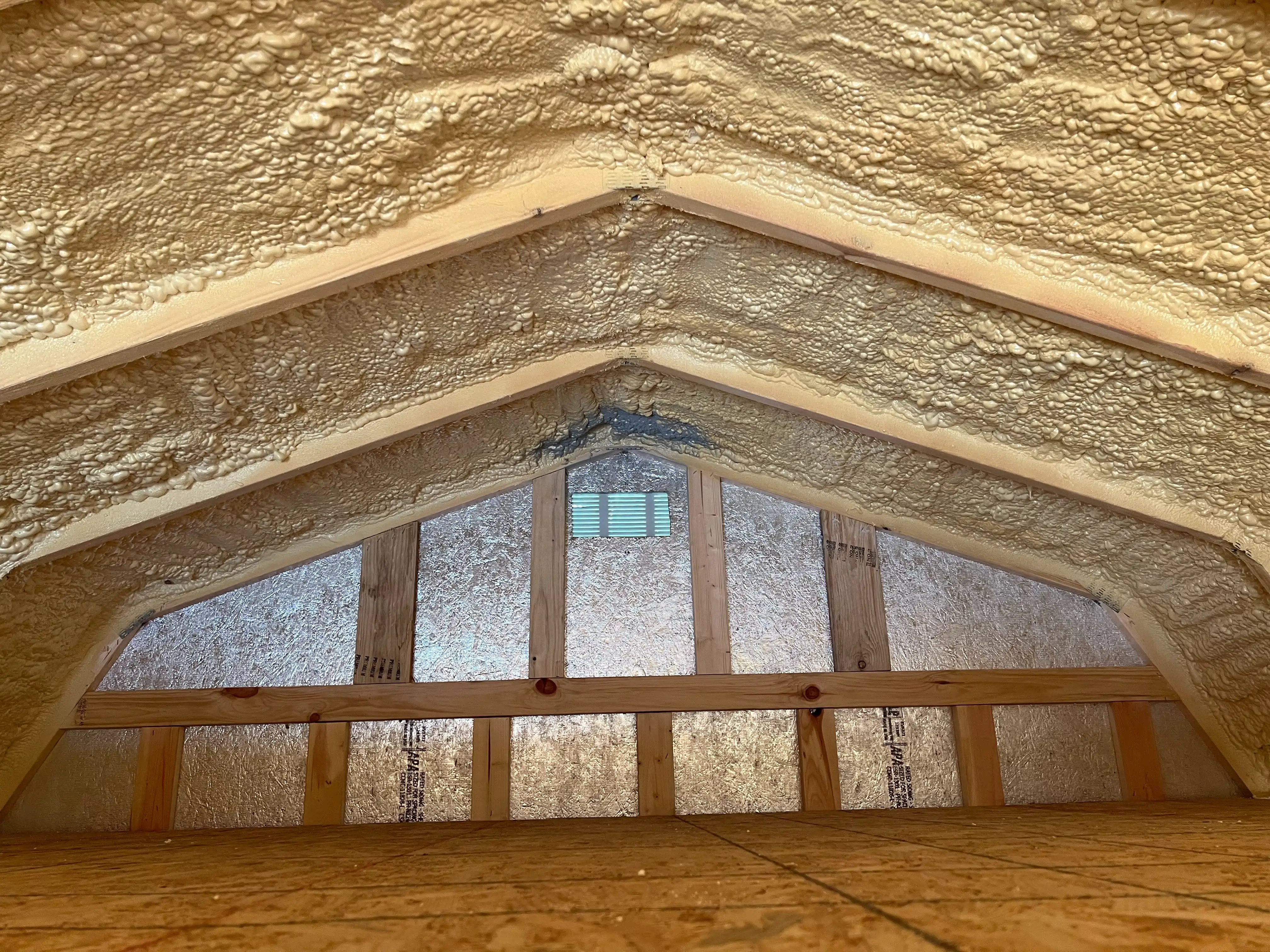 Interior of an insulated shed showing walls and ceiling.