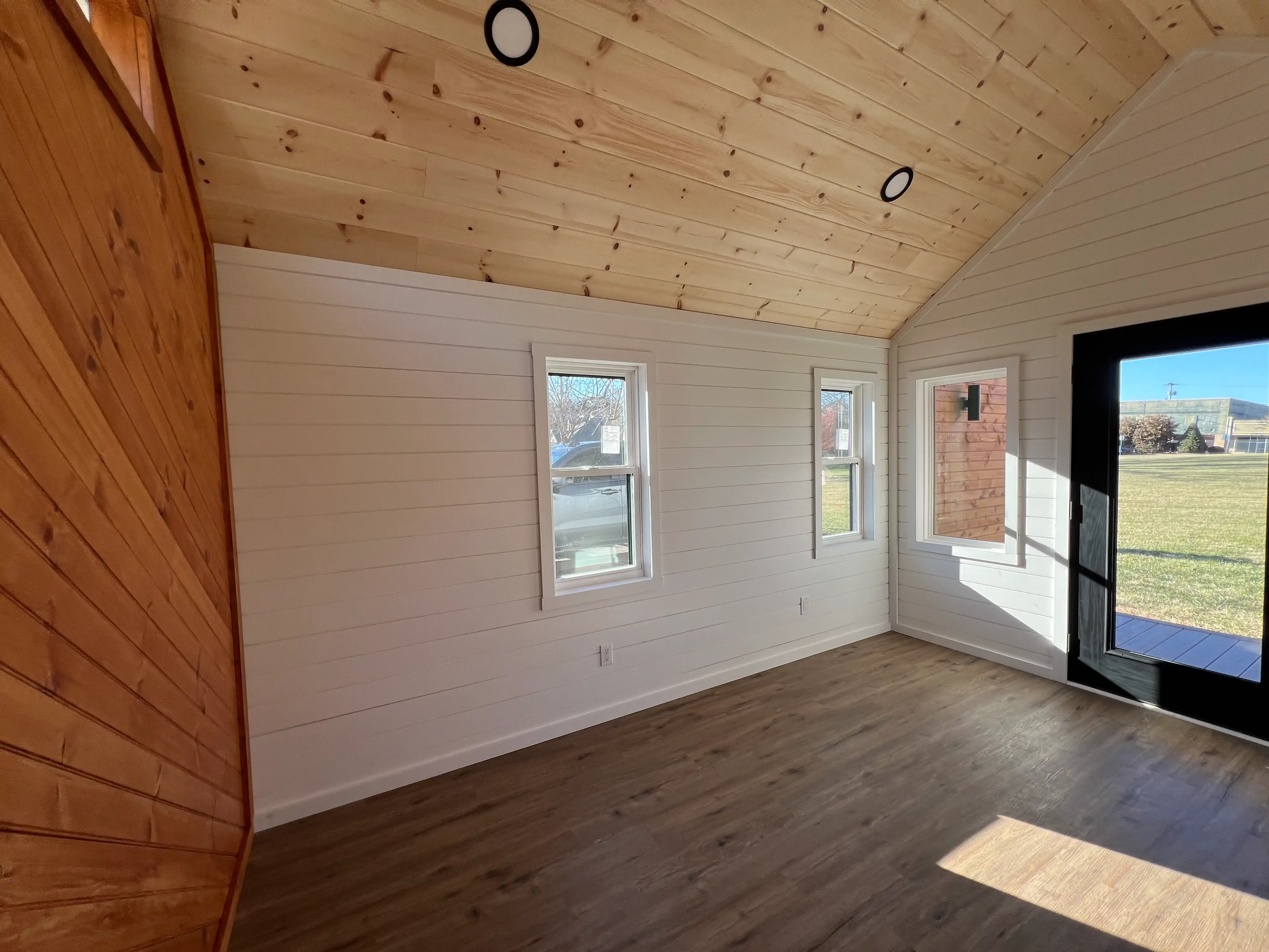A wooden portable shed on a sturdy, elevated foundation.