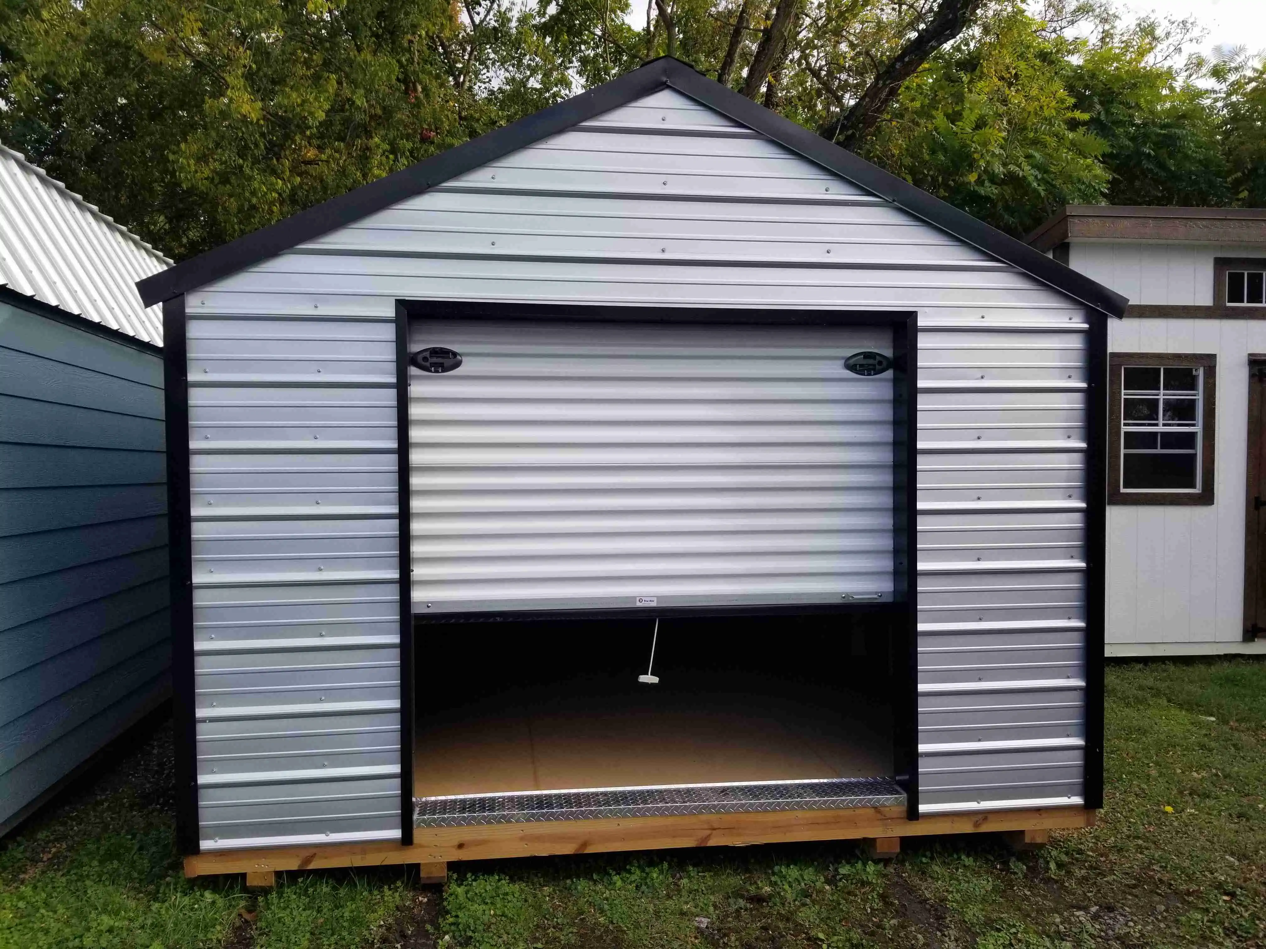 Standard utility shed with double doors on the front.
