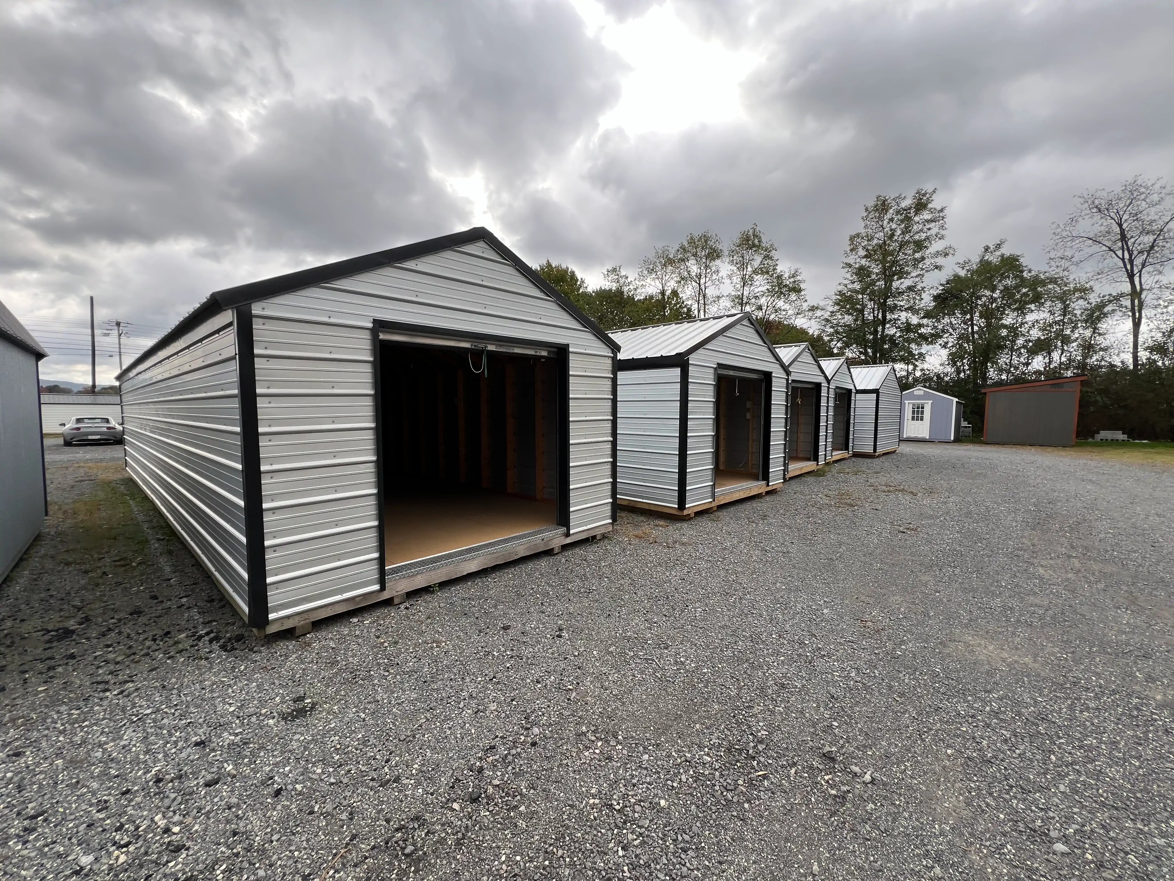 A classic A-frame utility shed in a backyard setting.